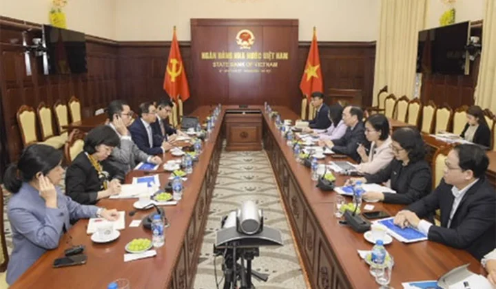 Phó Thống đốc Thường trực Ngân hàng Nhà nước Việt Nam Đào Minh Tú tiếp lãnh đạo UOB
