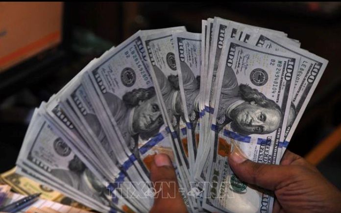 Dự báo lượng kiều hối về Thành phố Hồ Chí Minh đạt khoảng 10,5 tỷ USD, mức cao nhất từ trước đến nay. (Ảnh minh hoạ: AFP/TTXVN)