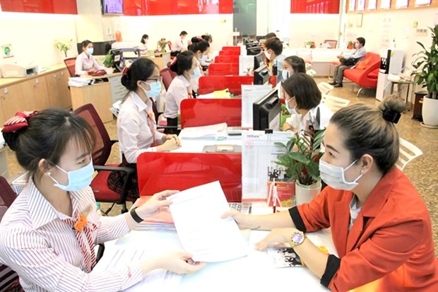 Firms are still facing difficulties in access to bank loans. (Photo: VNA)